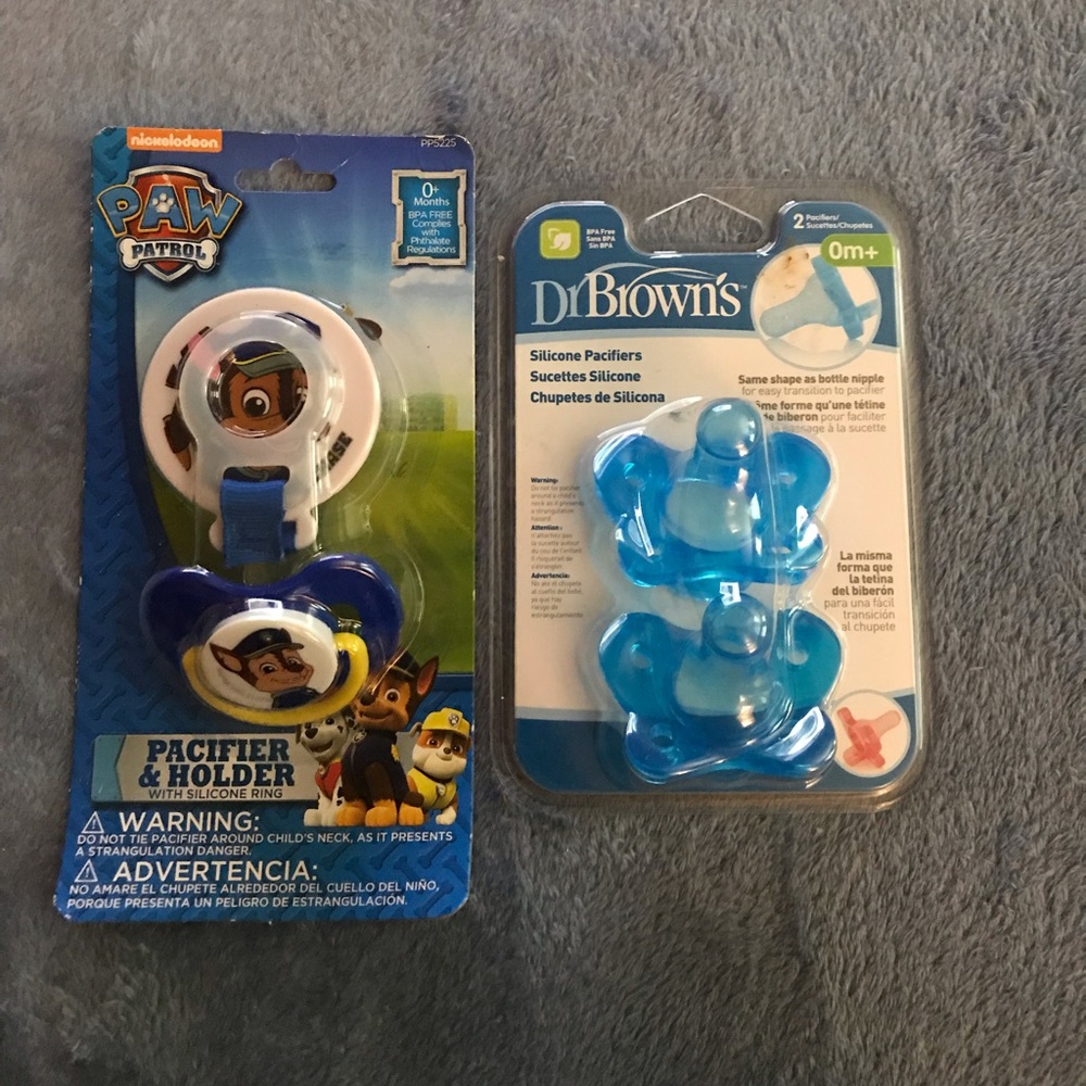3 Pacifiers with Paw patrol holder.